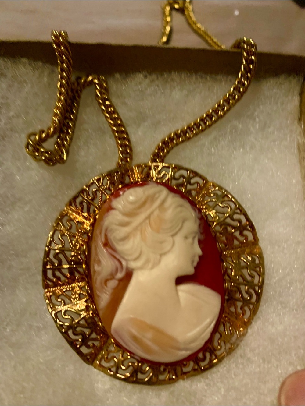 VINTAGE  CAMEO set in gold tone filigree setting with attached chain